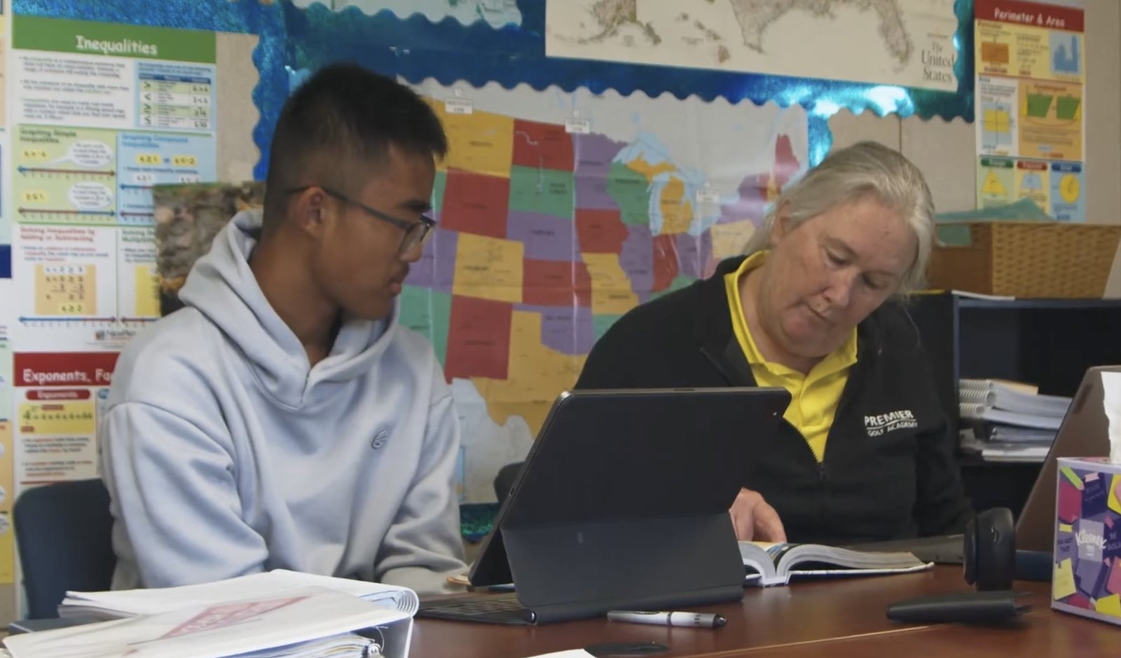Student in academics with Premier Golf Academy staff